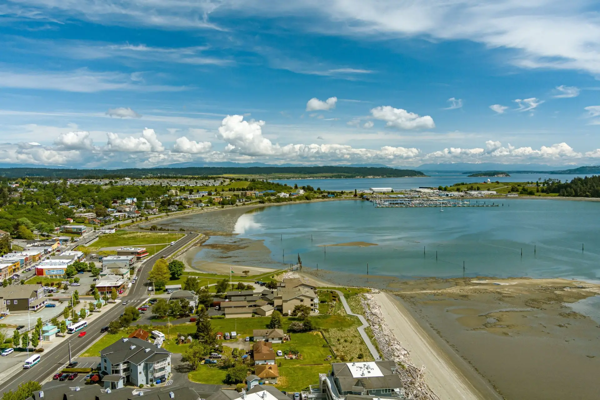 Aerial coastline view of Oak Harbor neighborhoods and marina, recommended by a Real Estate Expert in Oak Harbor WA.